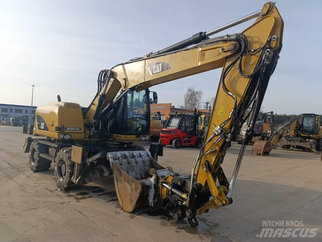 CAT M 313 D Escavadoras de rodas