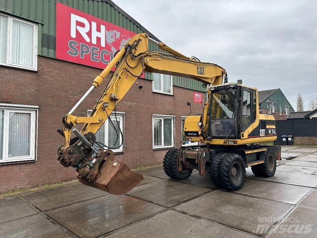 CAT M315 +ROTO CE Escavadoras de rodas
