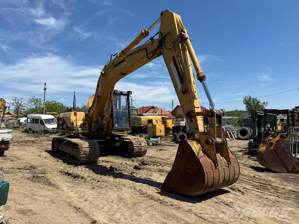 CAT 318 Rastos, correntes e material rodante