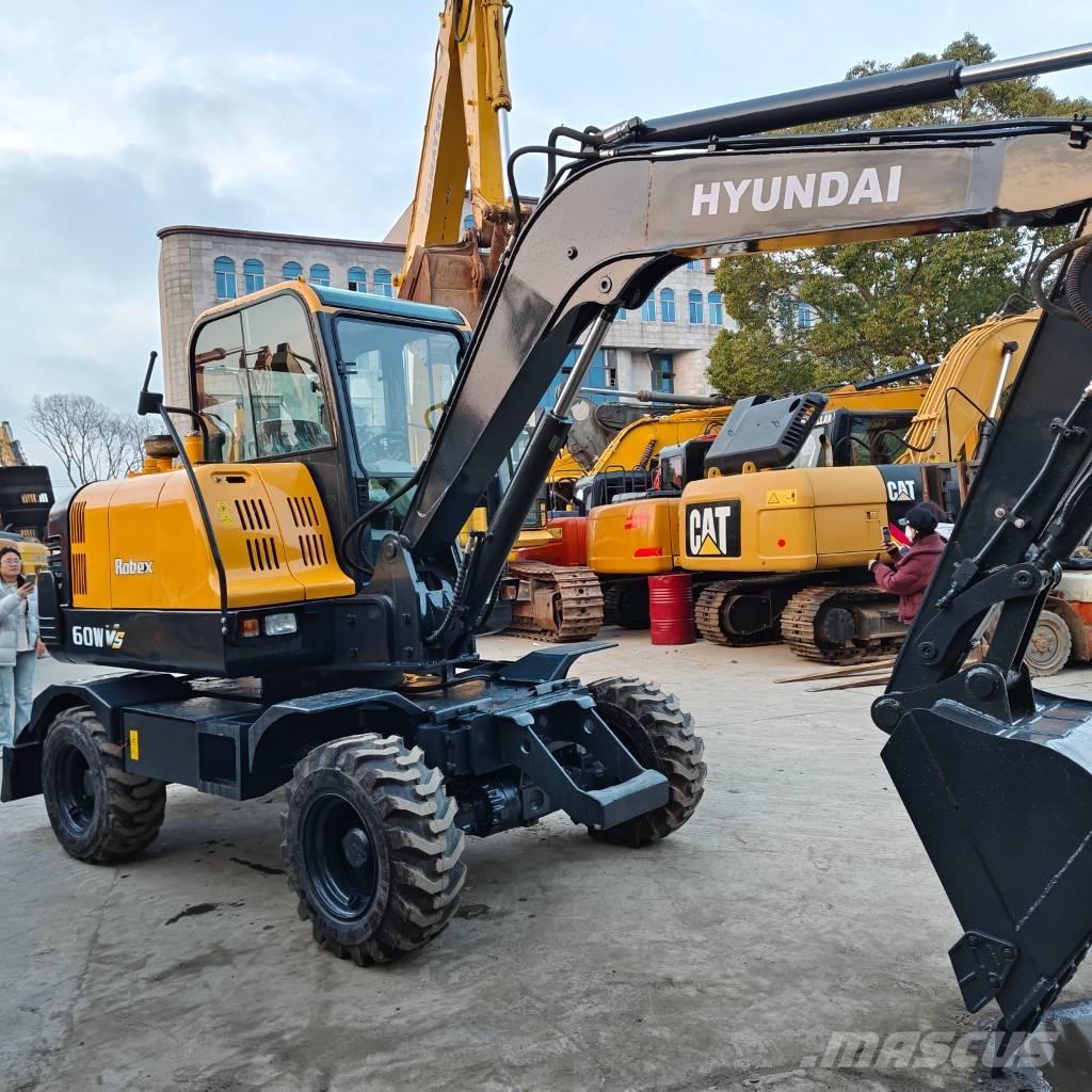 Hyundai 60 W VS Escavadoras de rodas