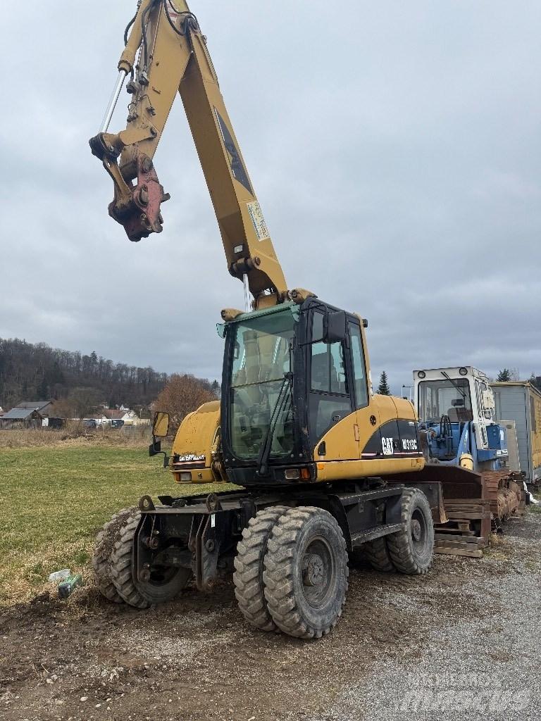 CAT M 313 C Escavadoras de rodas