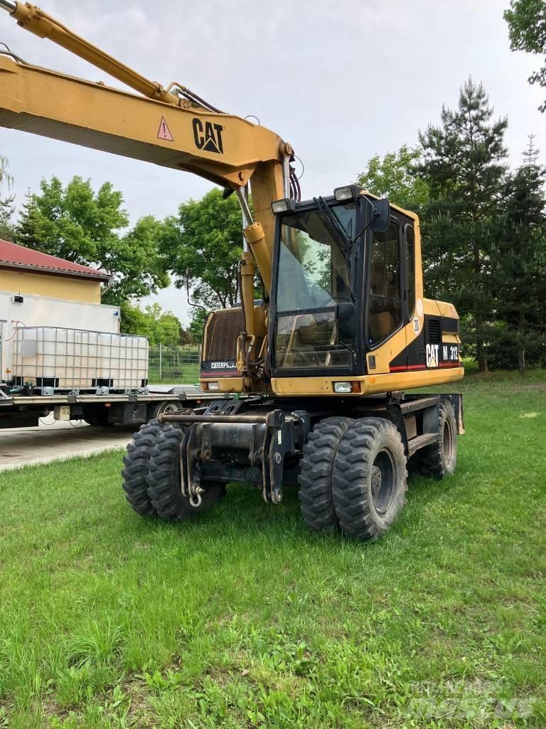 CAT M 312 Escavadoras de rodas
