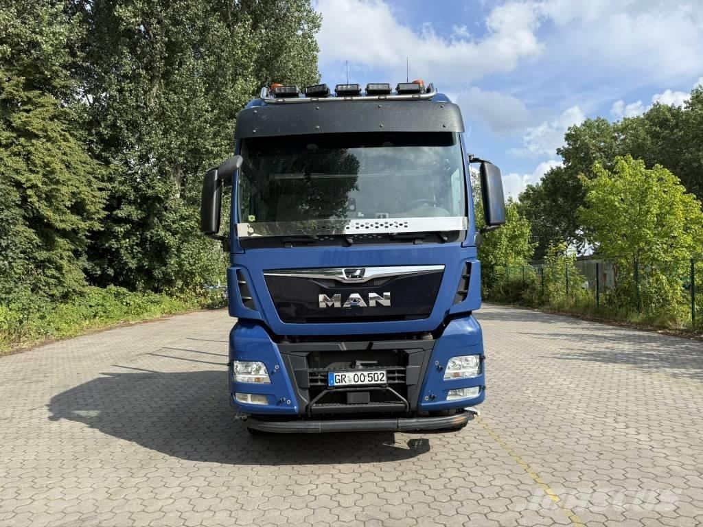 MAN TGX 33.500 Camiões de transporte de máquinas florestais