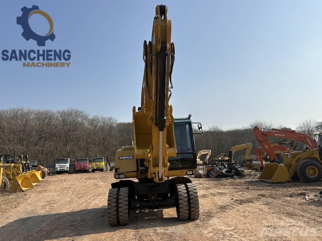 CAT M 320 D2 Escavadoras de rodas