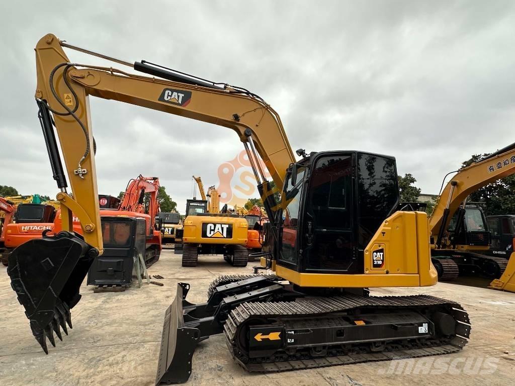 CAT 310 Escavadoras de rastos