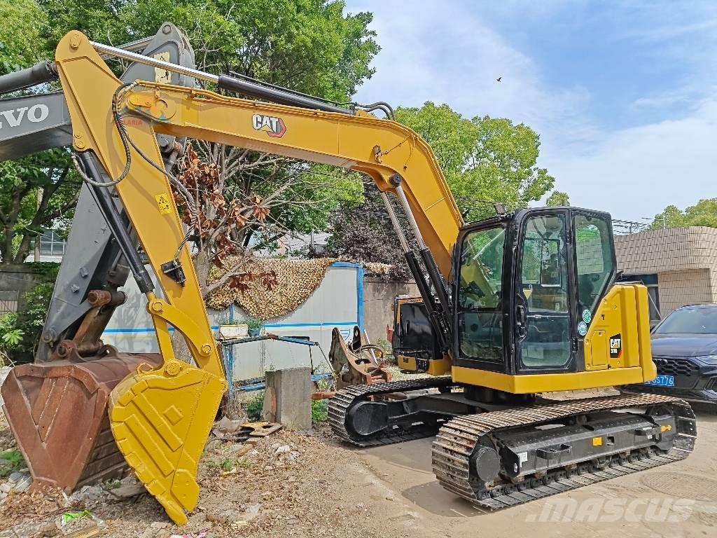 CAT 310 Escavadoras de rastos