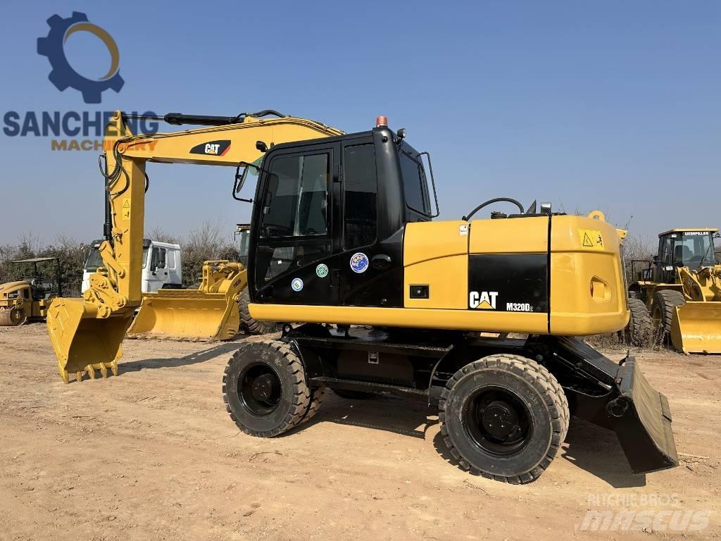 CAT M 320 D Escavadoras de rodas