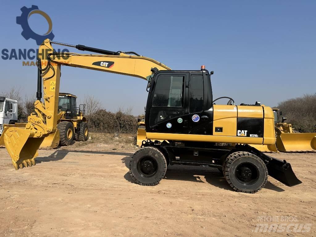 CAT M 320 D2 Escavadoras de rodas