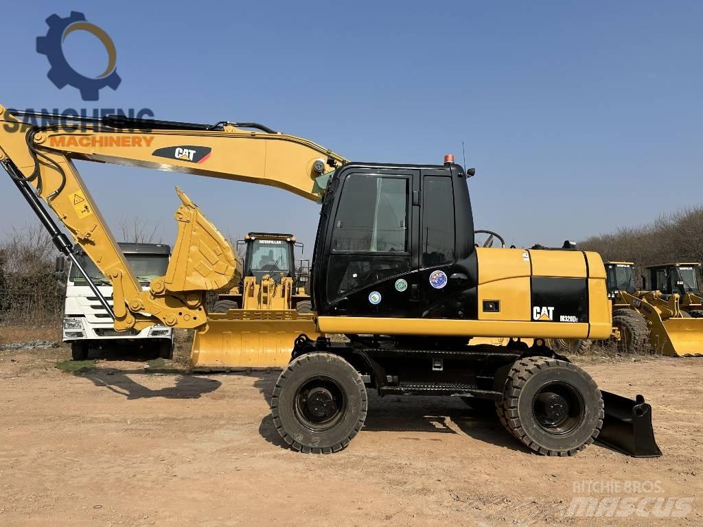 CAT M 320 D2 Escavadoras de rodas