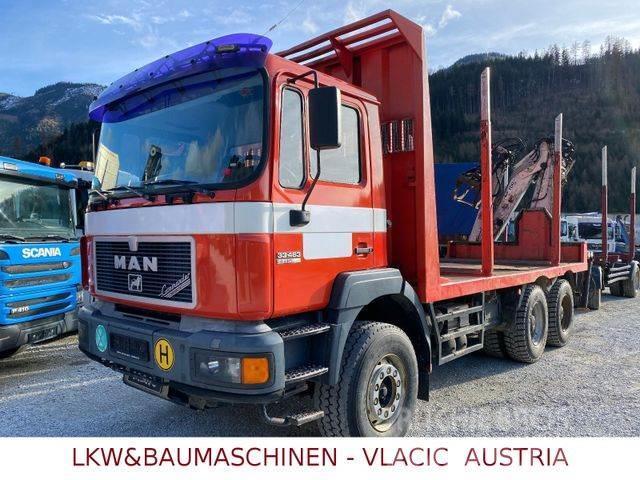 MAN 33.403 Holztransporter mit Kran PENZ Camiões de transporte de troncos